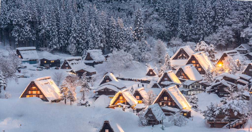 The historic thatched-roof houses of Shirakawa-go village covered in snow during winter in Japan.