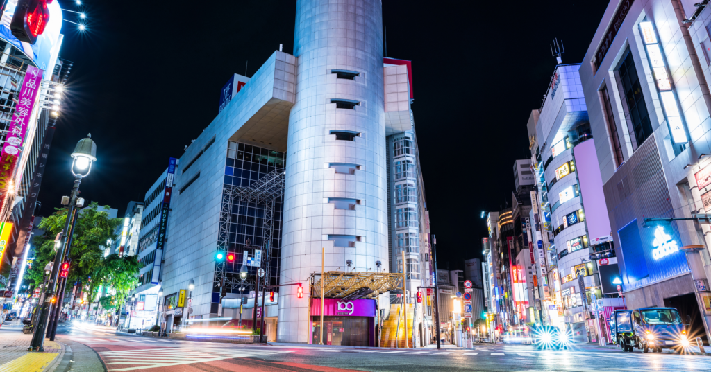 A cityscape of modern Tokyo with skyscrapers, neon signs, and bustling streets showcasing Japan’s dynamic urban lifestyle.